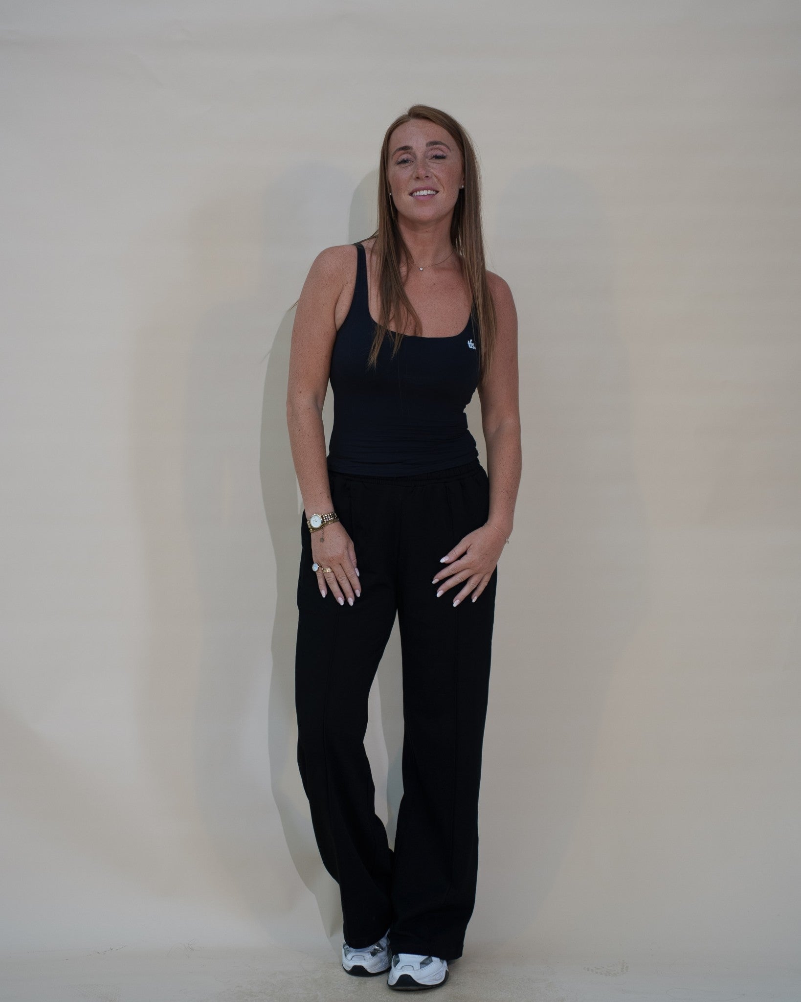 The Uniform Top — débardeur côtelé femme The Fit Society, noir, de face